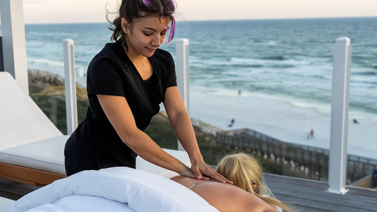 Massage therapist working oceanfront on 30A
